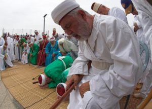 Mount Gerizim (near Nablus). The Samaritan community. Passover sacrifice ceremony. Eldest community men in traditional dress during praying together with The high Priest Elazar