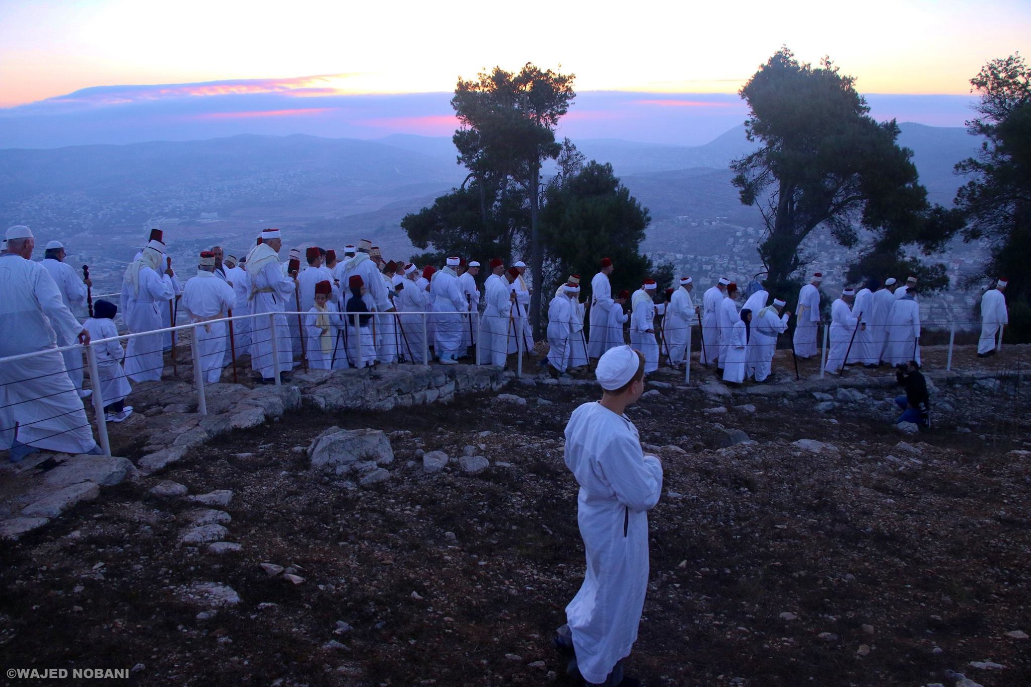 Performing the pilgrimage of the Feast of Tabernacles at the summit of Mount Gerizim.