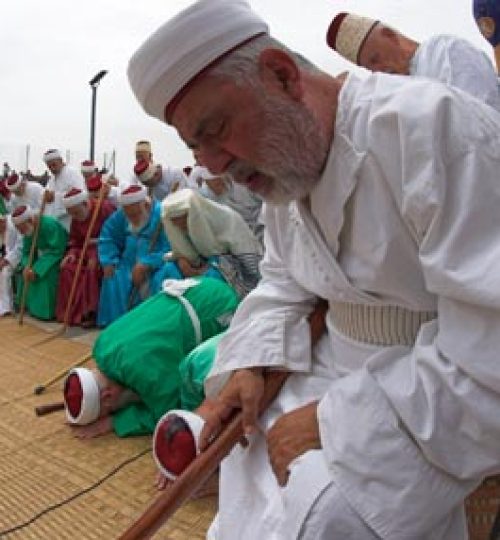 Mount Gerizim (near Nablus). The Samaritan community. Passover sacrifice ceremony. Eldest community men in traditional dress during praying together with The high Priest Elazar